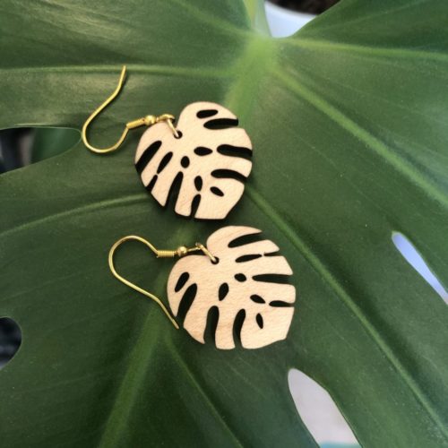 Monstera Maple-Wood Leaf Earrings Showcased on Plant